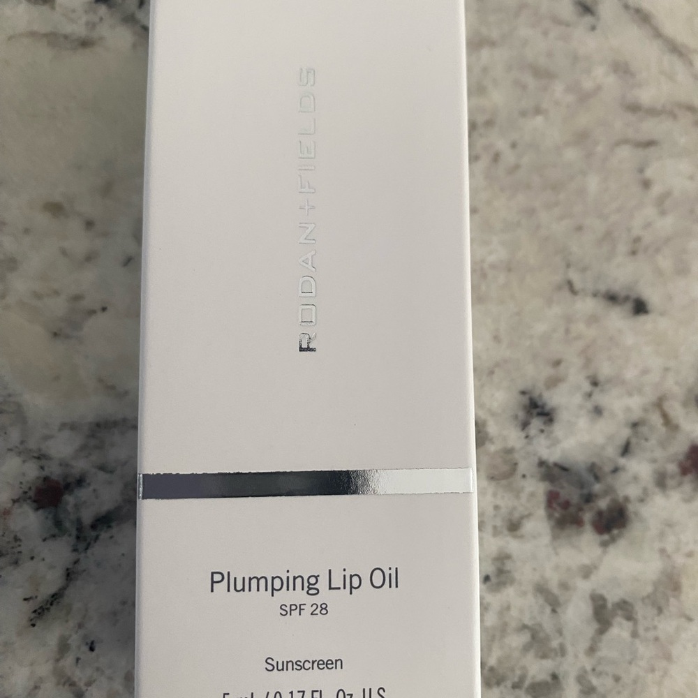 Rodan + Fields Lip Oil with Silver Detail